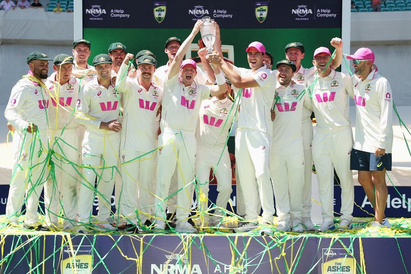 Australian players celebrate with the Ashes Waterford Crystal trophy after winning the Ashes series 4-1 during day five of the Fifth Test in the 2025/26 Ashes Series.