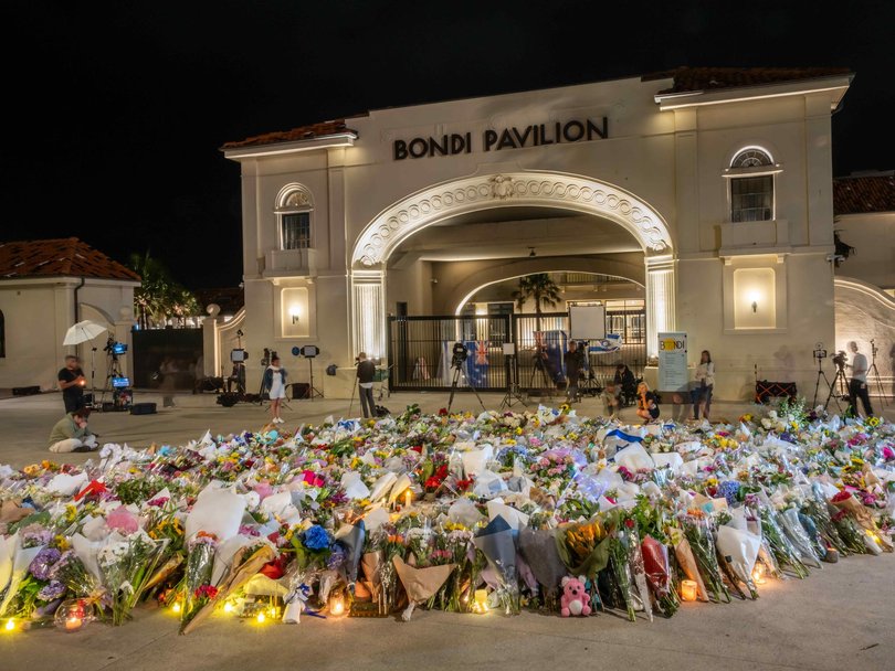 People photographed at a vigil at the Bondi Beach memorial. Picture: NewsWire / Monique Harmer