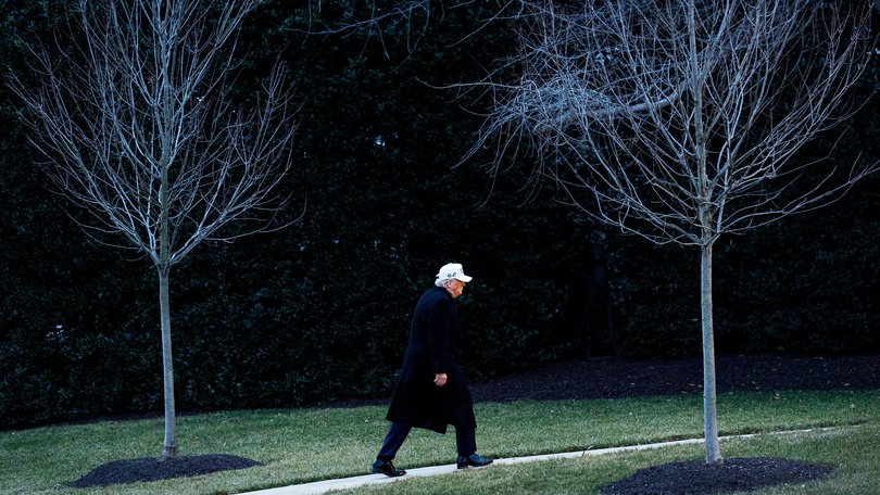 President Donald Trump makes his way to the Oval Office on the South Lawn of the White House on Tuesday.