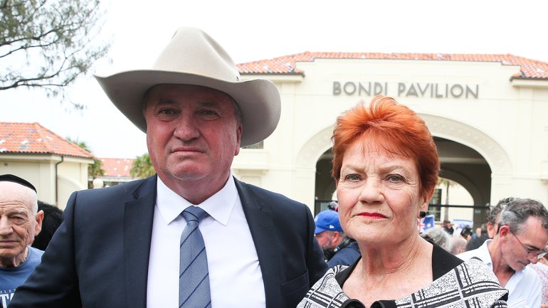 One Nation Leader Pauline Hanson and One Nation member for New England Barnaby Joyce place flowers at a makeshift memorial at Bondi Beach in Sydney.