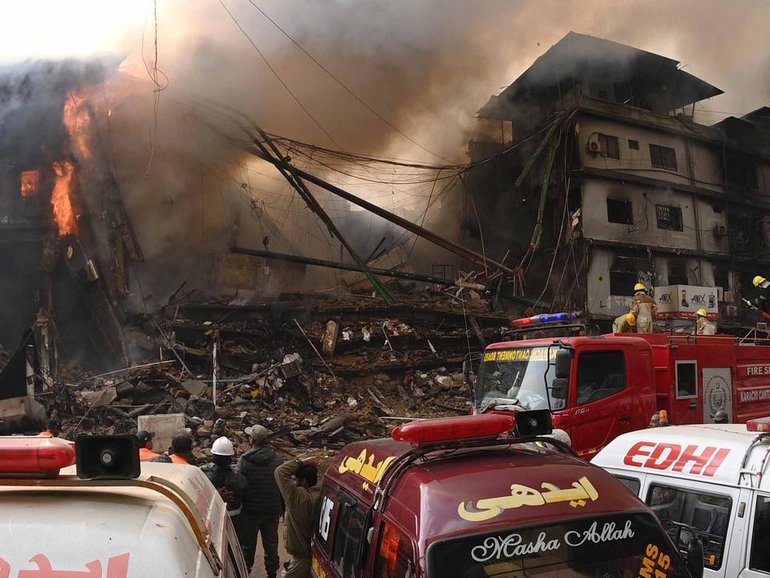 Firefighters worked through the night to contain the massive blaze. (EPA PHOTO)
