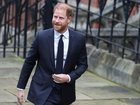 Prince Harry waved cheerfully at reporters as he entered London's High Court. (EPA PHOTO)