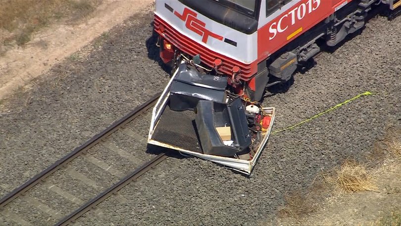 The tray of the ute at the very front of the train.