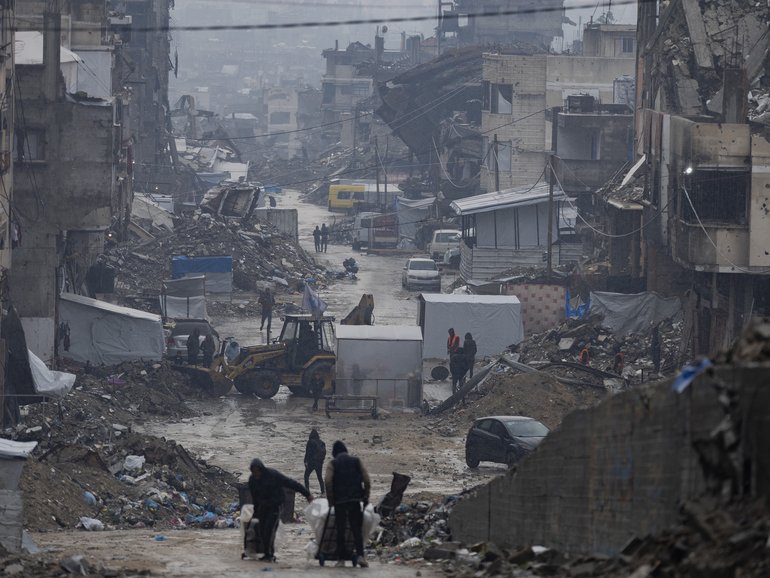 Destroyed buildings on a wet day in Gaza City, December 11, 2025.