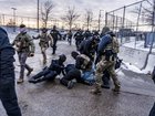 Federal agents detain a demonstrator outside of the Whipple Federal Building in Minneapolis on January 17.