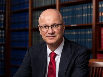 A prominent barrister has been charged after Australian Federal Police allegedly uncovered child abuse material on his phone at Sydney airport. 