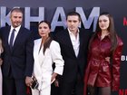 (L-R) Mia Regan, Romeo Beckham, Cruz Beckham, Harper Beckham, David Beckham, Victoria Beckham, Brooklyn Peltz Beckham, and Nicola Peltz Beckham attend the premiere of 'Beckham' in 2023.
