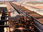 Rail cars laden with iron ore arrive at the receiving facility at Fortescue’s Herb Elliott Port in Port Hedland.