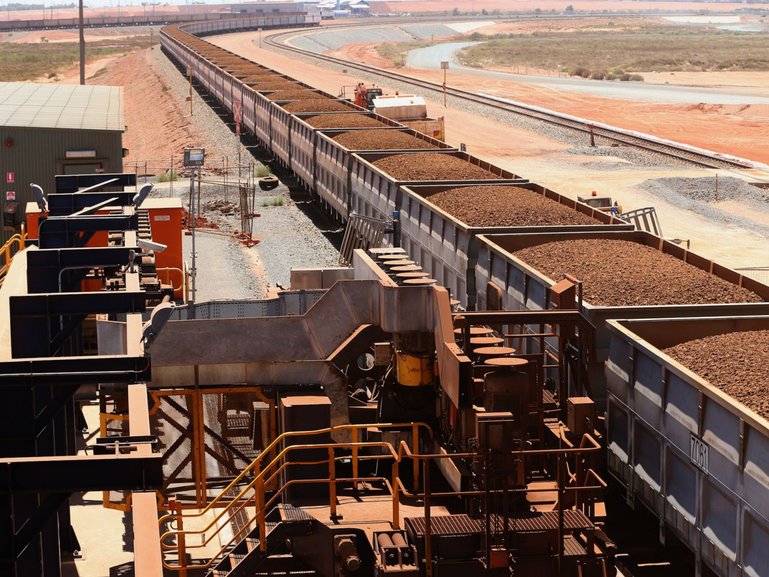 Rail cars laden with iron ore arrive at the receiving facility at Fortescue’s Herb Elliott Port in Port Hedland.