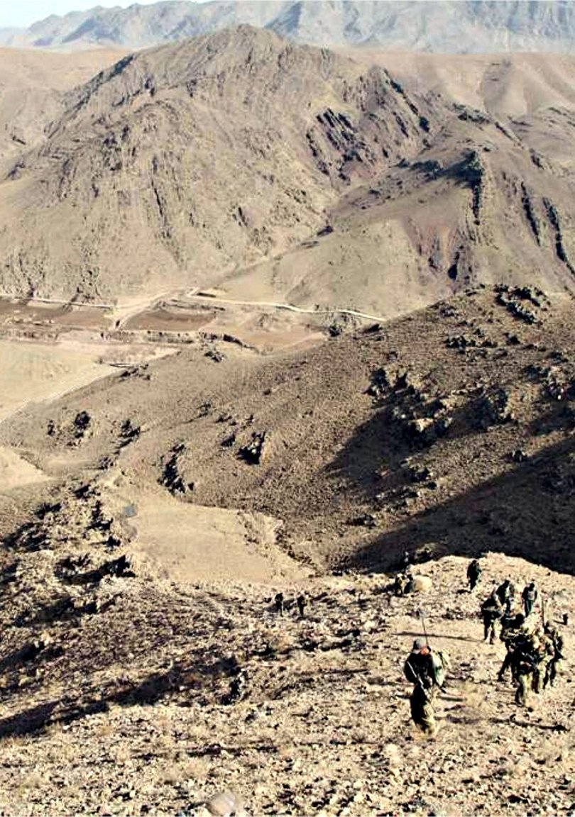Australian Special Forces soldiers summit a peak in Afghanistan during the war.