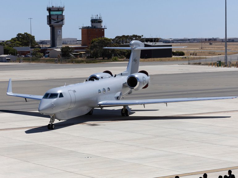 A No 10 Squadron (10SQN) MC-55A Peregrine aircraft taxis into position for the first time in front of the new 10SQN hangar at RAAF Base Edinburgh SA.