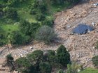 Rescuers are still at the scene two days after a landslide at Mount Maunganui in New Zealand. (AP PHOTO)