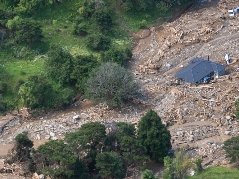 Rescuers are still at the scene two days after a landslide at Mount Maunganui in New Zealand. (AP PHOTO)