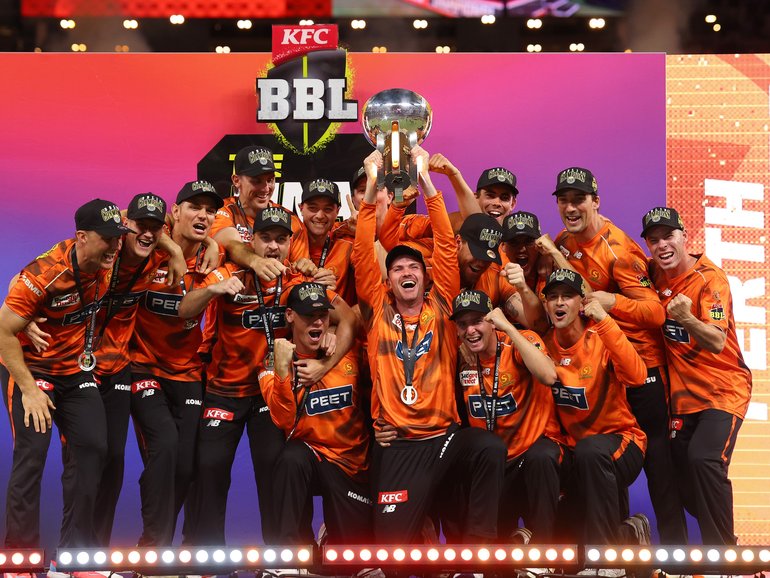 The Scorchers celebrate their win.