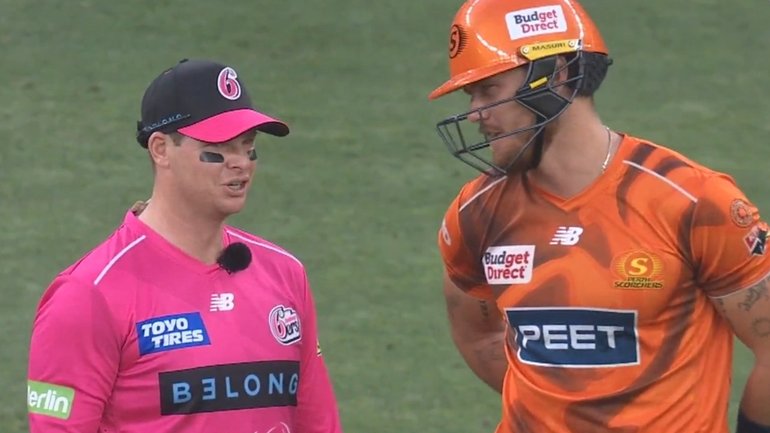 Steve Smith could not believe play continued in the rain, with even Finn Allen protecting his bat from the weather.