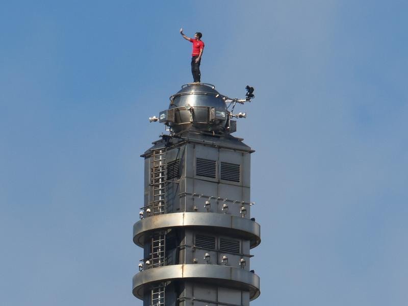 Honnold takes a selfie at the top.
