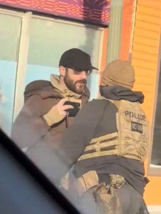 Minneapolis man Alex Pretti interacts with federal agents before being shot. 