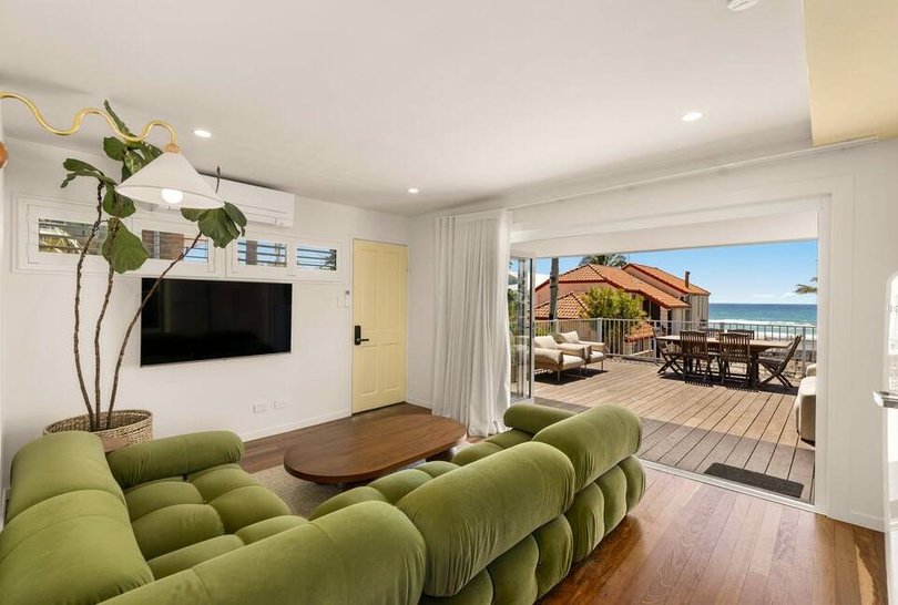 Bi-fold doors open to the deck.