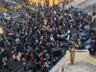 Protesters gather near the site in Minneapolis where Alex Pretti was shot and killed by federal immigration agents, on Saturday, January 24, 2026. 