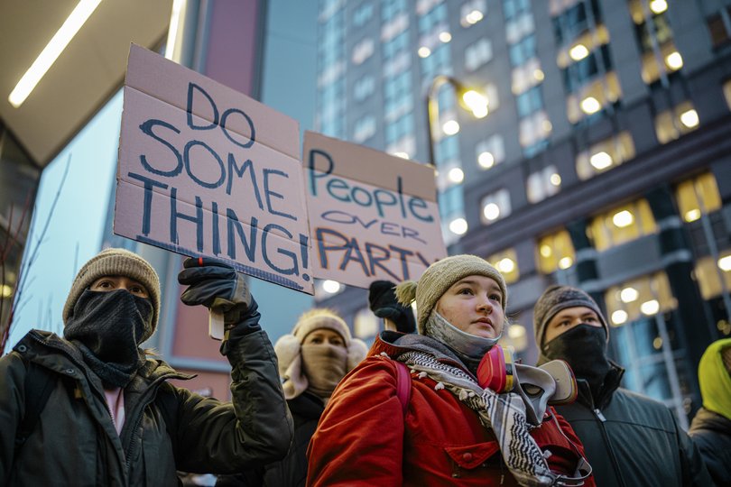 People attend a protest against immigration enforcement actions during a rally in Minneapolis on Monday, Jan. 26, 2026. 
