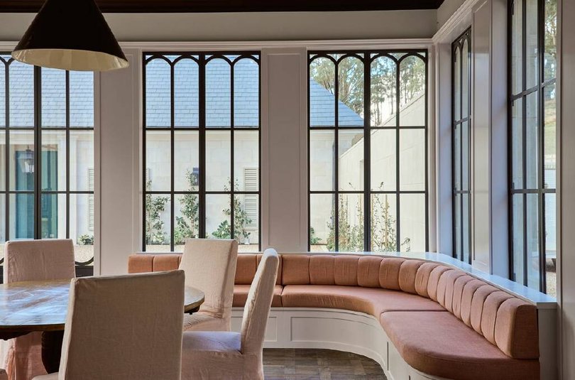 The bespoke interiors include a custom made curved window seat with views to the courtyard.