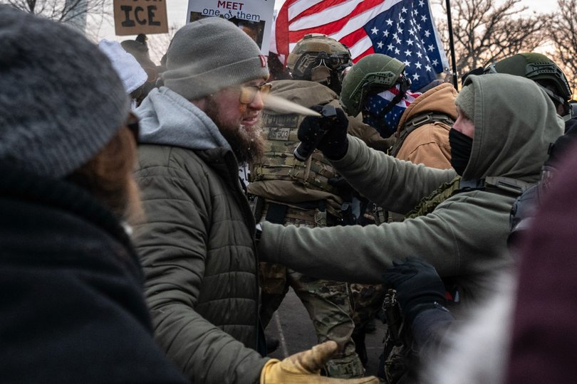 Federal law enforcement officers use pepper spray against a demonstrator during a protest in Minnesota on January 17.