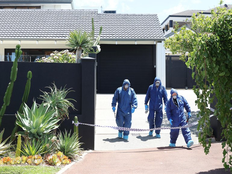 Forensics officers at Mott Close on Friday.