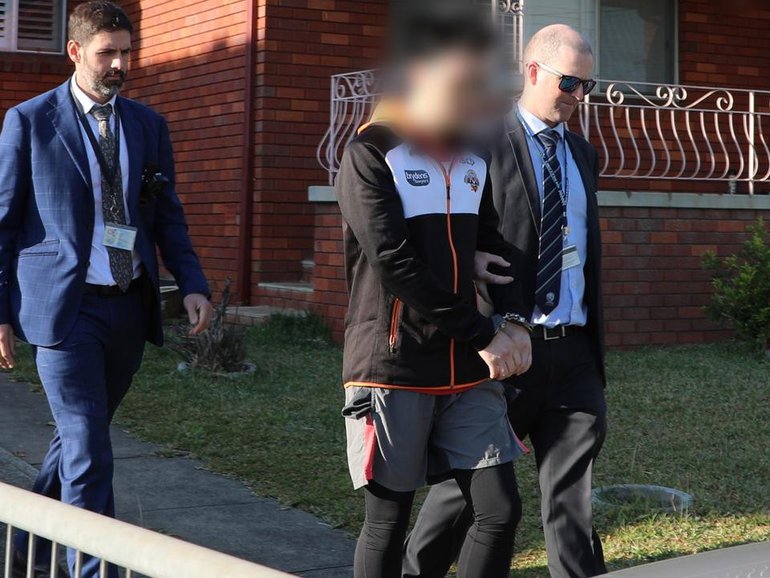 Award-winning author Oliver Phommavanh is behind bars after admitting child sexual offences. (HANDOUT/NSW POLICE)