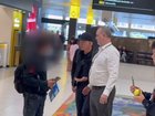 Tennis legend John McEnroe has lost his cool with a persistent fan at Melbourne Airport.