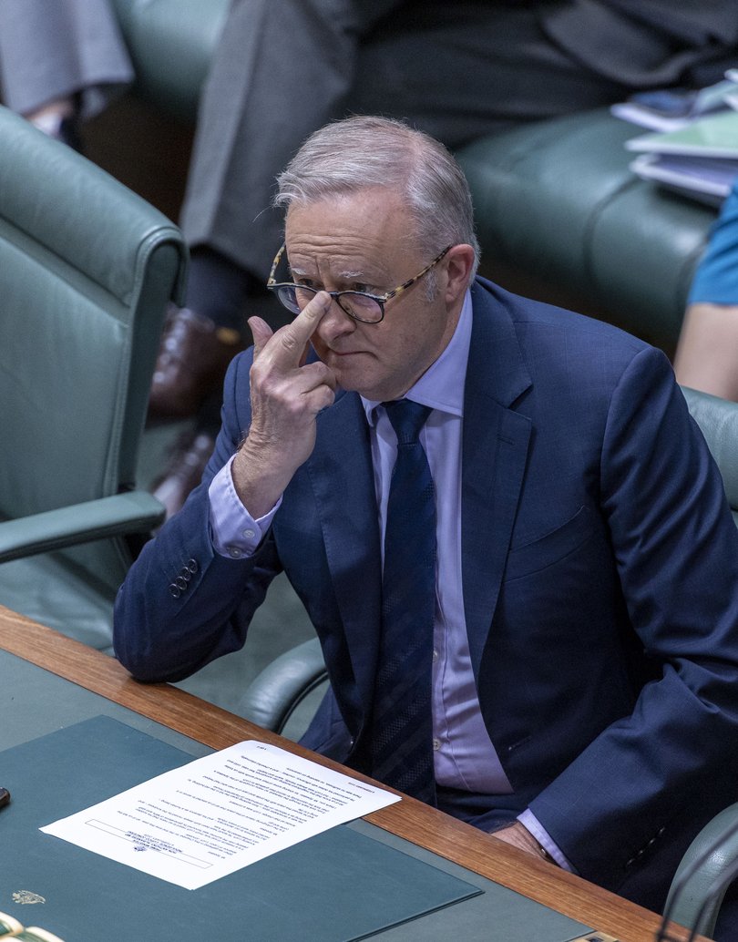 Prime Minister Anthony Albanese makes a point of “fixing” his glasses.