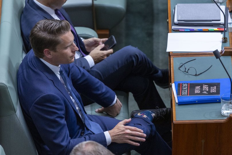 Andrew Hastie with a copy of The Art of War during Question Time.