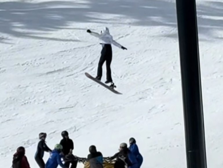 Horrifying footage shows the moment a young snowboarder plunges nine metres off a ski chairlift.