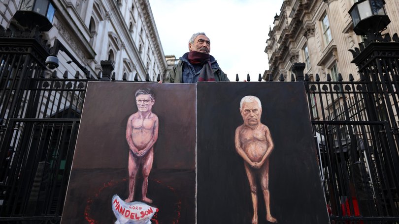 Political satire artist Kaya Mar with his paintings of British Prime Minister Keir Starmer and Andrew Mountbatten-Windsor outside Downing Street on February 4.
