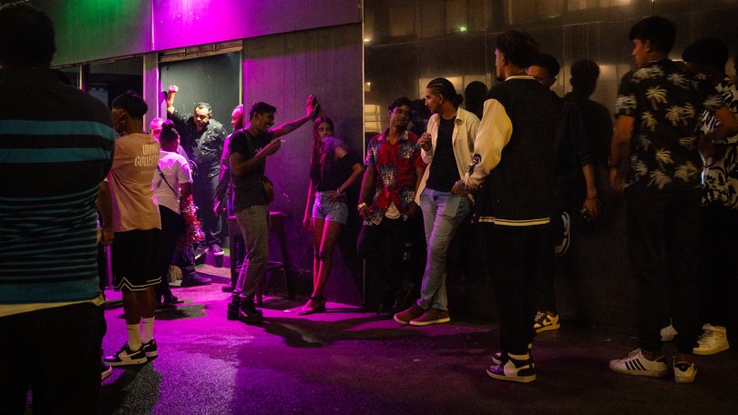 Guests wait outside a nightclub in Suva.