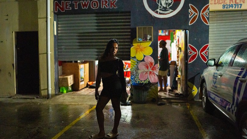 A sex worker waits outside the Survival Advocacy Network.