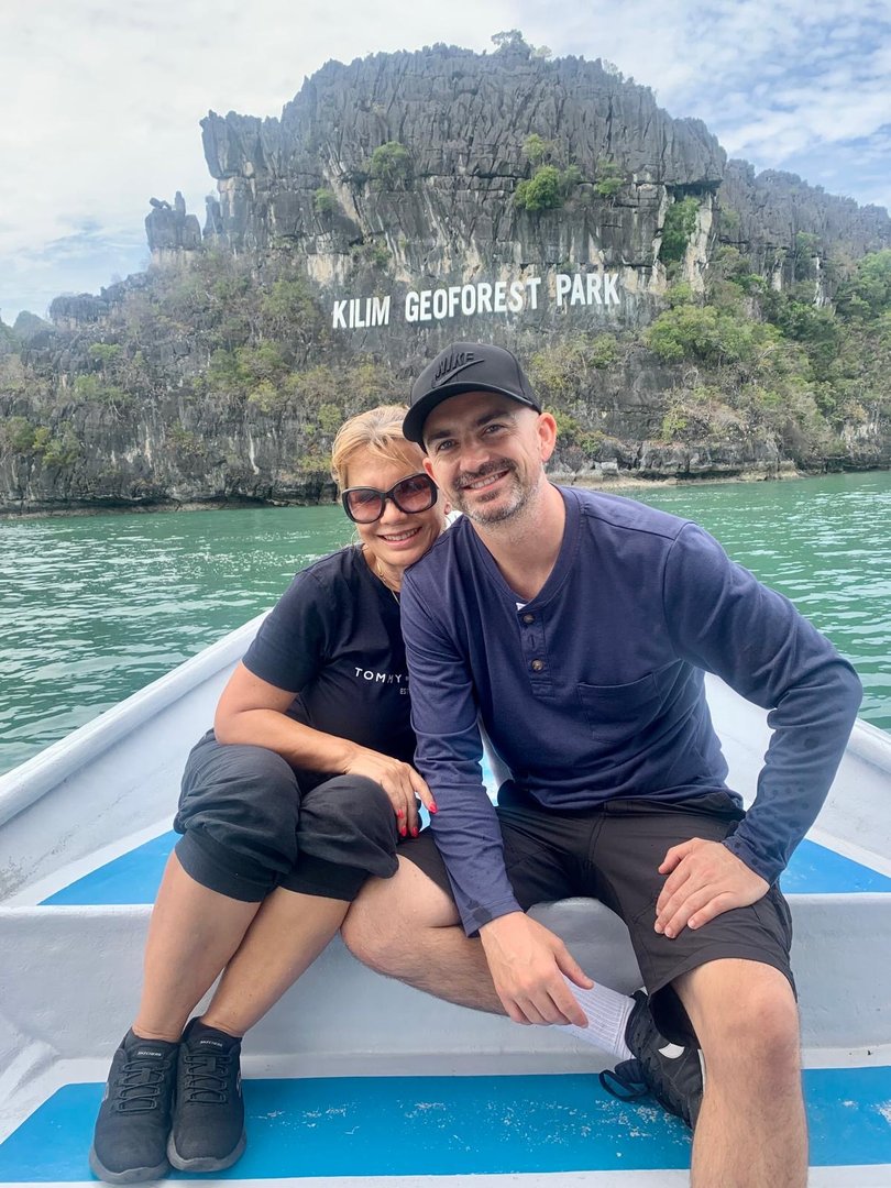 David Gow and his partner on holiday, Mr Gow is from Perth and quit his job age 28 after 10 years spent saving and investing. He now advocates for the FIRE personal finance movement.