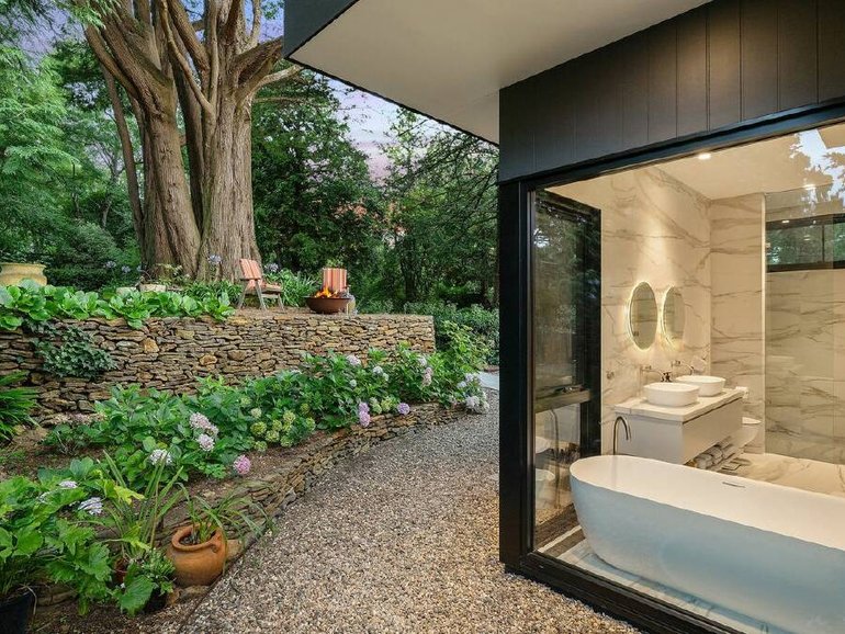 The Leura home even has a view of the garden from the bath.