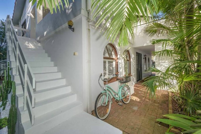 Arched windows are a feature of the house.