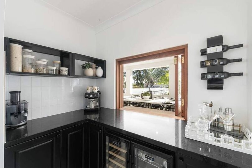 The servery window opens to the outdoor terrace.