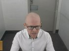 In this photo made from video and provided by the New Zealand Court of Appeal, Monday, Feb. 9, 2026, Brenton Tarrant appears before the court by video from Auckland Prison in Auckland. (New Zealand Court of Appeal via AP) New Zealand Court of Appeal
