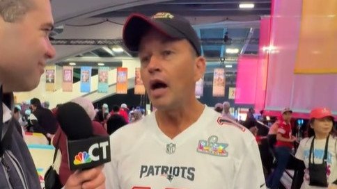 The Melbourne father is interviewed before the start of the Super Bowl.
