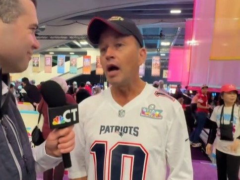 The Melbourne father is interviewed before the start of the Super Bowl.