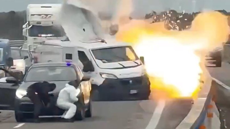 Heavily-armed robbers posing as police blocked an Italian highway and blew up an armoured van during a brazen raid in southern Italy, before exchanging gunfire with police. 