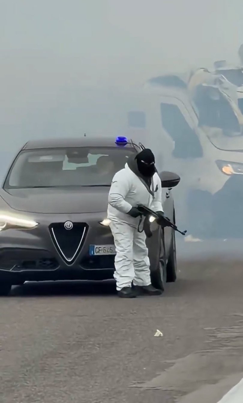 One of the gunmen after the explosion.