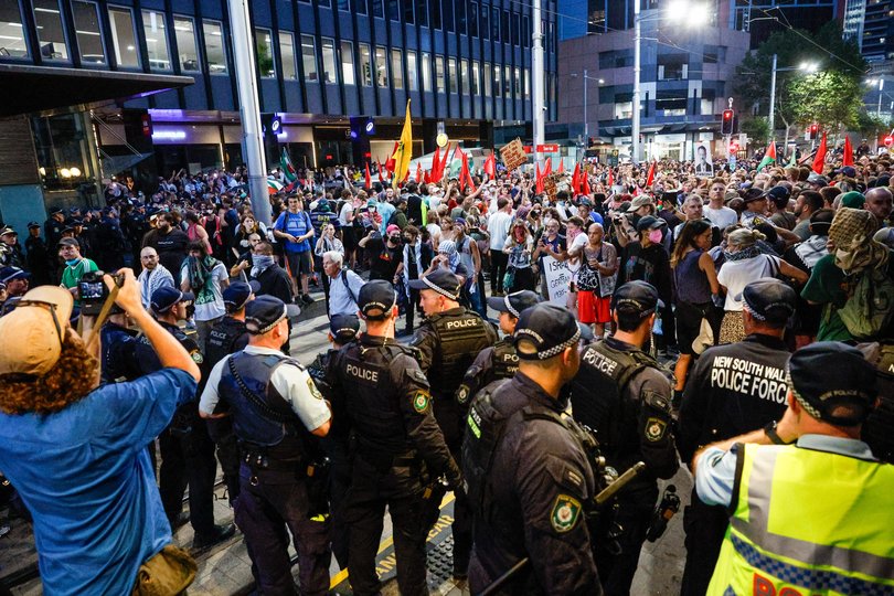 SYDNEY, AUSTRALIA - FEBRUARY 09: Police detain protesters during a protest against the visit of Israel's President Isaac Herzog on February 09, 2026 in Sydney, Australia. Herzog is on a visit to Australia from Feb 8-12 that will take in official engagements as well as meetings with the Jewish community. (Photo by Izhar Khan/Getty Images)