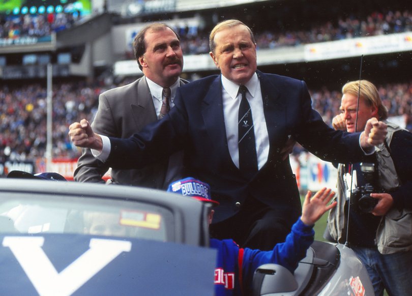 MELBOURNE, AUSTRALIA - 1995: E. J. 'Ted' Whitton former Footscray Football Club player acknowledges the crowd at his farewell parade before the VFL State of Origin match between Victoria and South Australia at the Melbourne Cricket Ground 1995 in Melbourne, Australia.(photo by Getty Images)