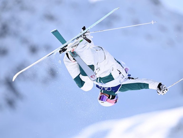 Australia's Cooper Woods has won Olympic gold in the men's moguls at Livigno. 