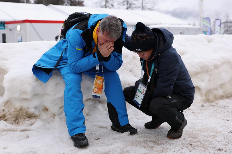 Chanmin Chyun, President of the Korea Bobsleigh and Skeleton Federation (R) consoles Mykhailo Heraskevych, father and coach of Vladyslav Heraskevych  Images) Picture: Richard Heathcote