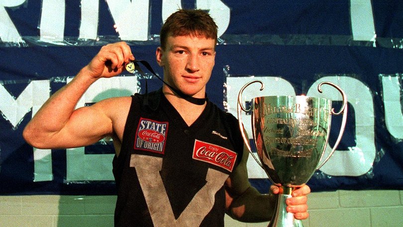 Brent Harvey for Victoria in the rooms with the trophy and the E.J Whitten Medal after the State of Origin AFL match between Victoria and South Australia at the Melbourne Cricket Ground in Melbourne on May 29, 1999.