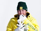 Josie Baff celebrates with tears of joy after striking snowboard cross gold at the Olympics. 